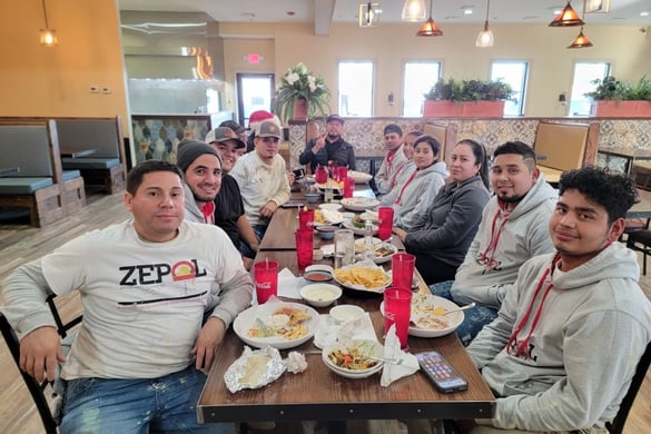 A picture of the Zepol team eating at a restaurant.