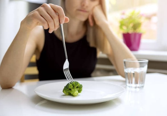 Pushing broccoli around on plate
