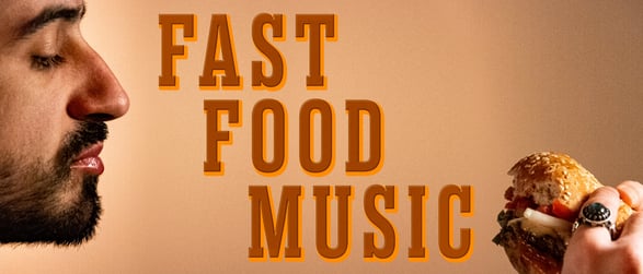 A bearded man gazing at a half-eaten cheeseburger, with a title art reading ‘Fast Food Music’