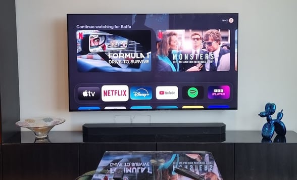 TV mounted on a plasterboard wall using a Vogels Motorised TV mount. All cables hidden