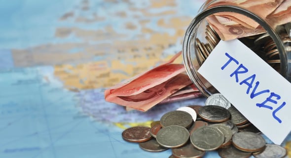 a jar of money with a travel tag on it