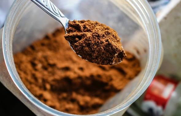 a spoon full of cocoa powder