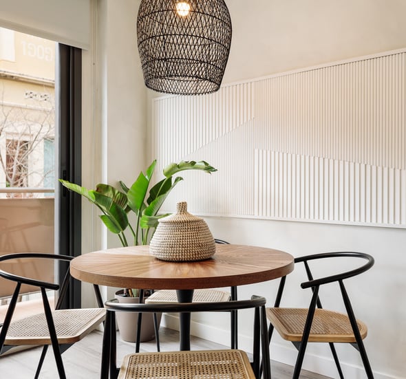Elegant dining area with bespoke relief wall panels and contemporary furniture and sleek design