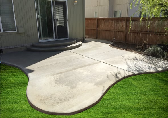Organically shaped poured concrete patio with broomed surface