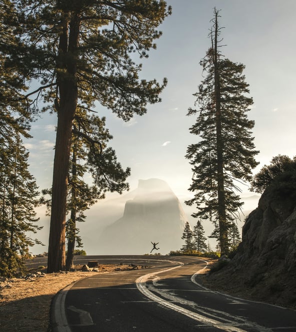a person riding a bike down a mountain road