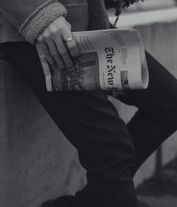 a man with high standards holding a newspaper