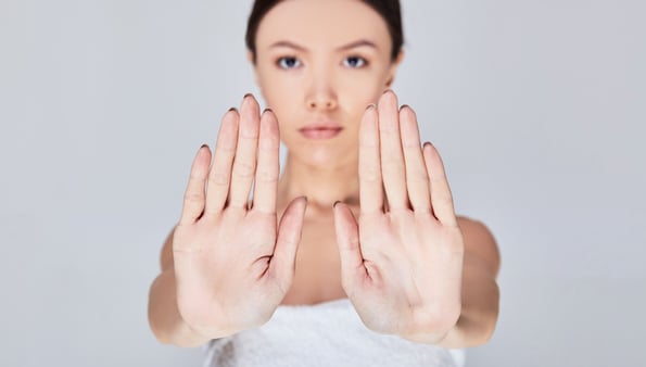 a woman with her hands up and her hands up