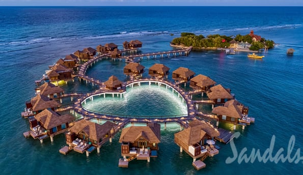 a circular shaped fountain in the middle of a body of water