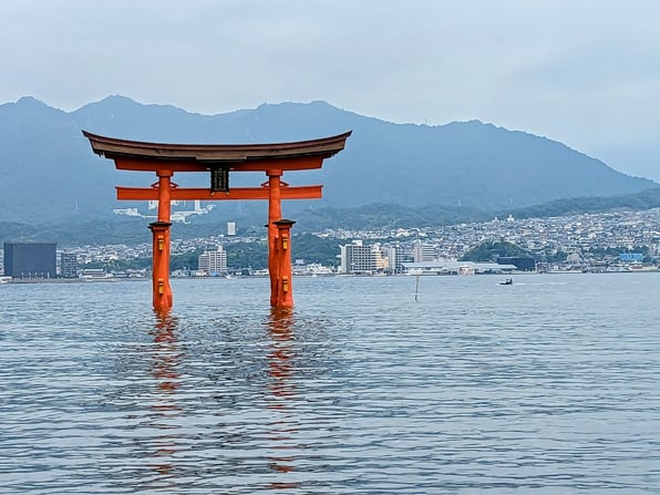 Miyajima Tori Gate and Hiroshima city in the background