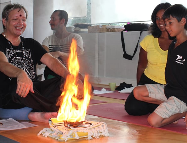 man performing a fire ritual