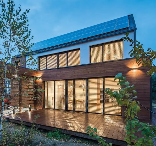 a house with solar panels and solar panels