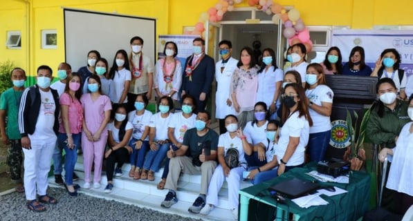 a group of people wearing masks on a stage