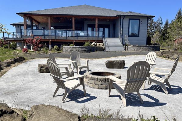 Organically shaped brushed concrete patio with fire pit