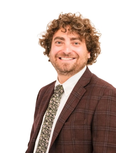 Ari Malman, Denver Attorney; a man in a suit and tie smiling