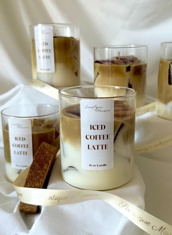 Luxury coffee and caramel candle with a ribbon around it with gold lettering