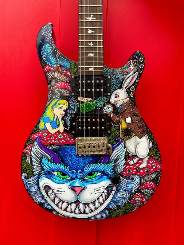 Alice in Wonderland – Hand painted guitar by Nancy Elhallak of Graffiti Garage