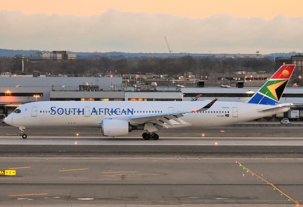 a plane is sitting on the runway at the airport