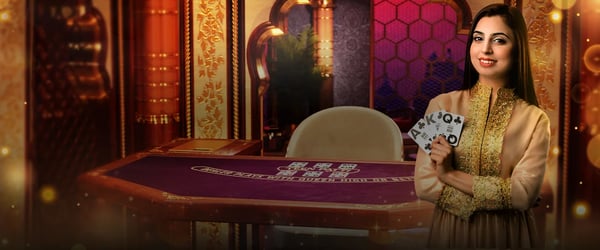 a woman holding a card game in front of a casino table