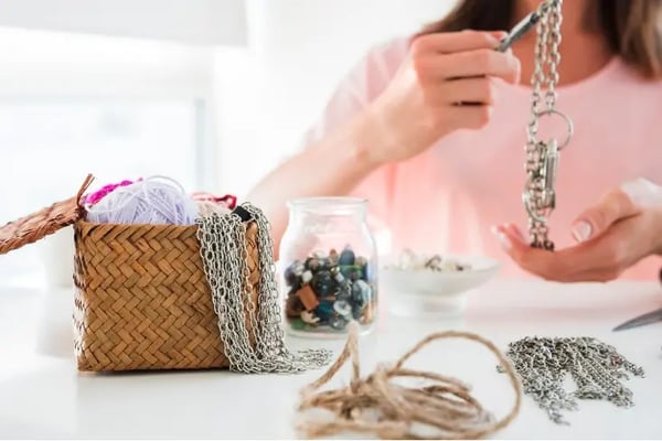 A Woman Perfecting Her New Jewelry Creation