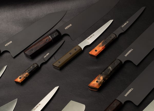 a variety of baltic blades and knives on a table