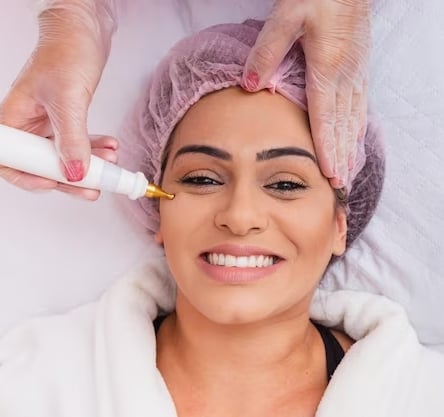 a woman having a skin treatment at an aesthetic clinic