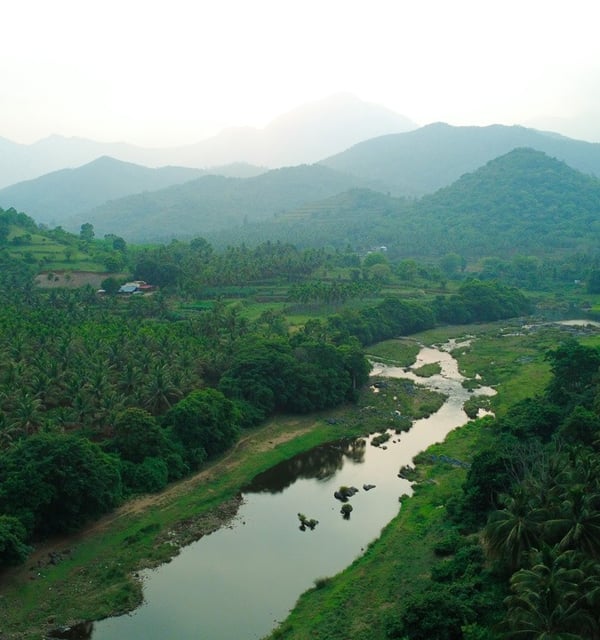 a river with rocks and rocks in the foreground