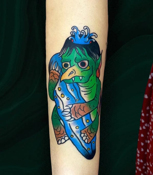This is a traditional japanese tattoo of the Kappa but also with touch of cartoon style