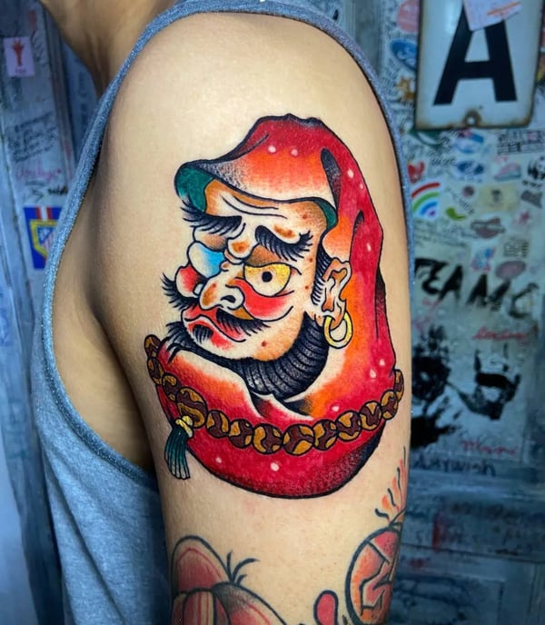 A traditional japanese tattoo of Daruma the Yokai