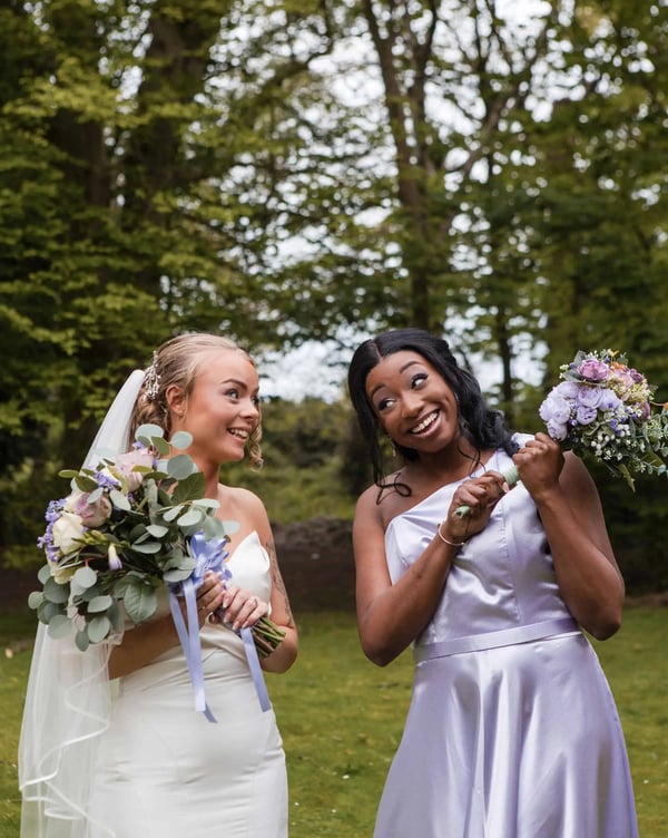 bride photographed with her maid of honour on her wedding day