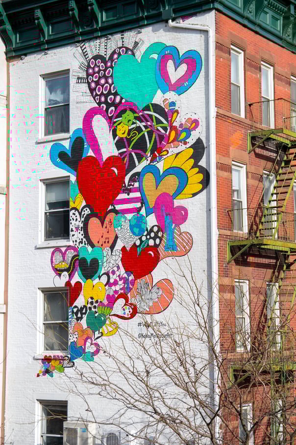 Beautiful colourful heart art work bubbling up th eside of an apartment building in Hudson Years, New York.
