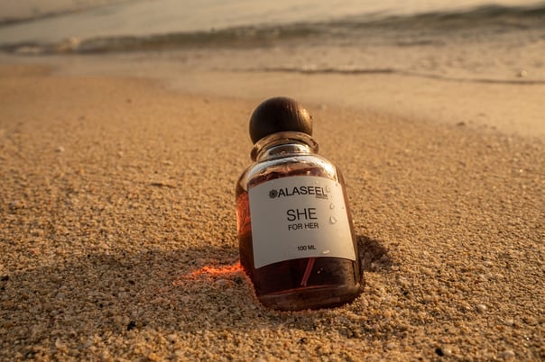 SHE fragrance half positioned in the sand, SHE launch by ALASEEL, Kite Beach | NBmore