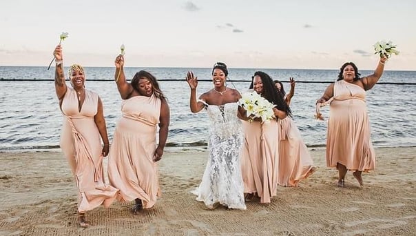 a bride and groomsmid are posing for a photo