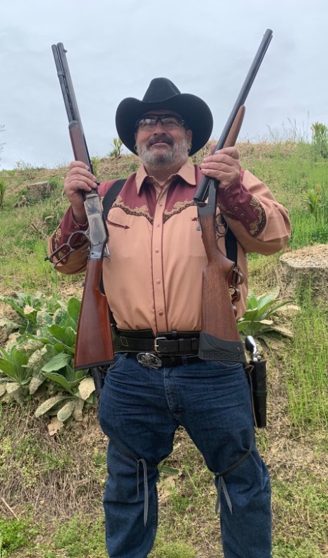 a man in a cowboy hat and a cowboy hat