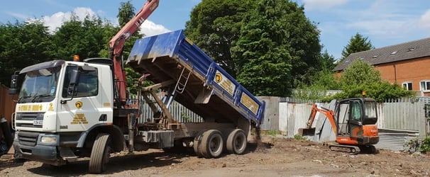 grabber and mini digger on a site in west brom