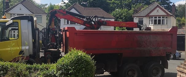 red grabber van outside a house on stourbridge