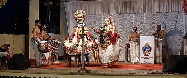 Kathakali dancers in traditional costume and makeup – classical dance of Kerala South India travel