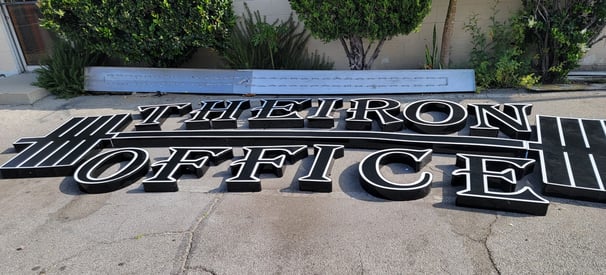 a sign that says Therion Office