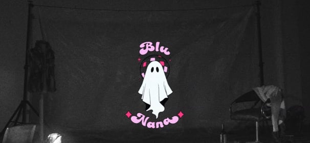a ghost ghost with a ghost in the background