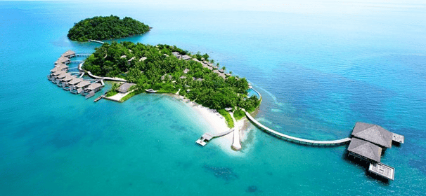 a small island with a small island in the middle of the ocean