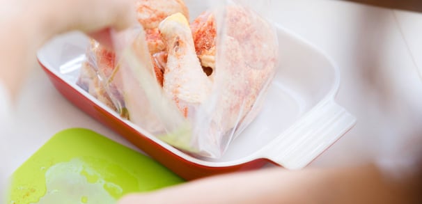 putting chicken in a ziplock pouch