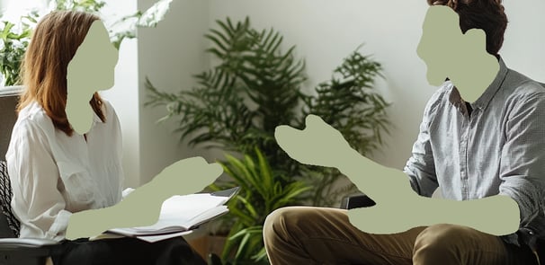 seated man and woman conversing in individual therapy session