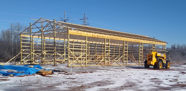 a construction site with a construction crane and a construction worker