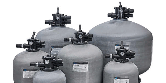 a group of large filtration tanks with valves