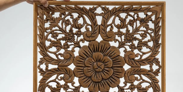 a wooden carved wood paneled panel
