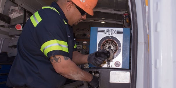 mobile hydraulic hose technician working on site crimping a hydraulic hose