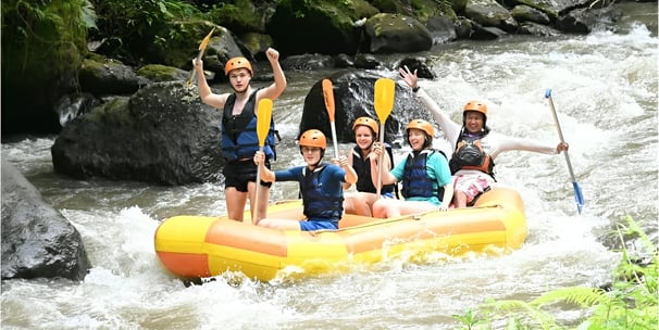 Tropical waterfall view during exciting Ubud Bali rafting tour experience