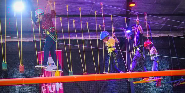 a group of people on a rope - tied rope