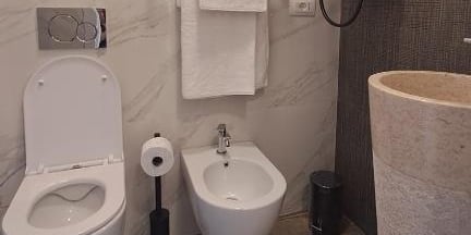 a bathroom with a toilet and a sink
