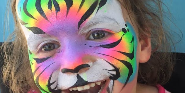 A Rainbow Tiger Face Painting at a Las Vegas Party