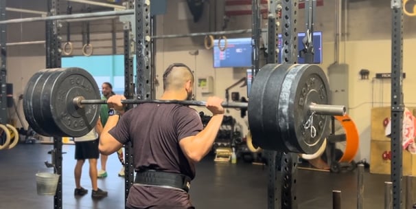 1:1 remote client doing back squats